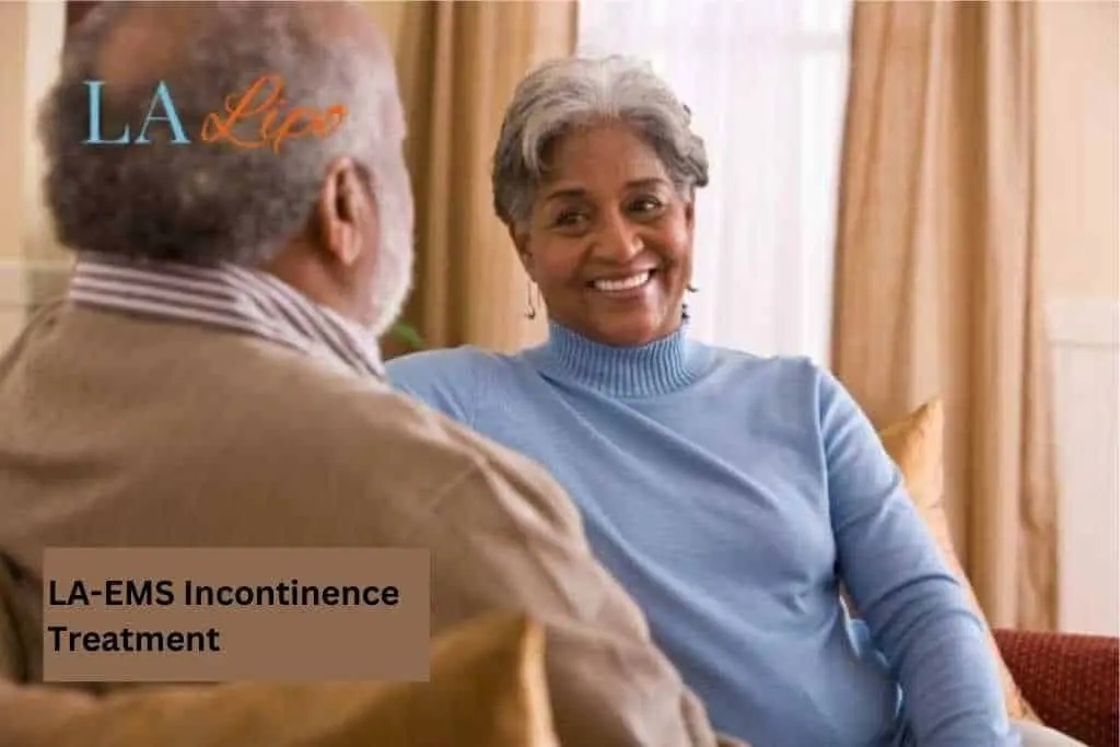 Couple sat smiling at each other - LA-EMS treatment Belsize Park