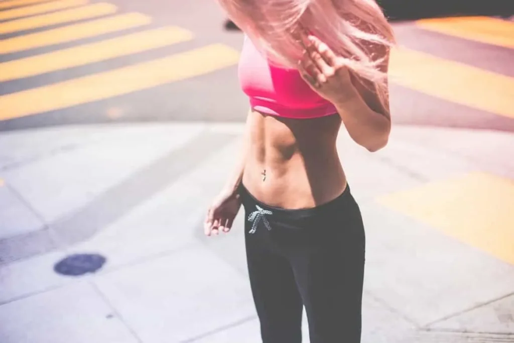 Woman with toned stomach after LA-EMS Body Sculpting Treatment Belsize Park 